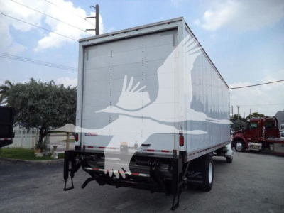 Freightliner M2 106 box truck rear view showing liftgate, white cargo box with bird graphic, taillights, bumper, and dual rear wheels.