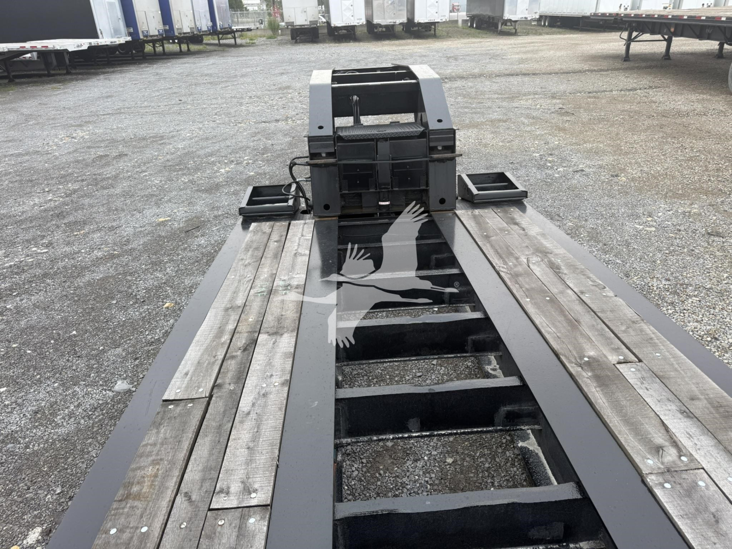 Trailer chassis frame showing main I-beam rails and gooseneck hitch area for a 2015 Eager Beaver 55Gsl-3 lowboy trailer.