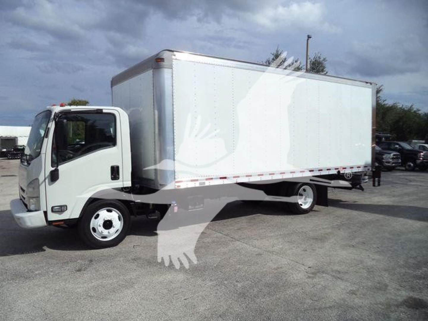 Isuzu NPR box truck with white cab and large rectangular cargo box, side view showing the box and front wheel.