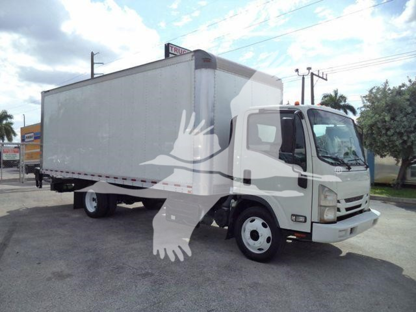 Isuzu NPR/NRR box truck in view showing cargo box and cab with stock number 210706FM.