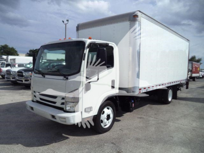 Isuzu NPR box truck in light color showing cargo box and cab with front view. Visible wheels, cab mirrors, and box body.