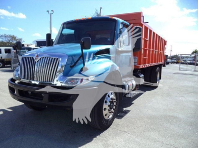 Dump truck 2020 International MV with blue cab and red dump body, side view showing front grille and wheel, stock #T51680.