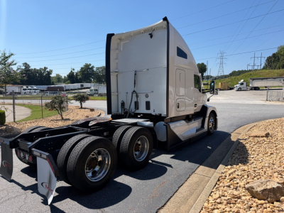 Kenworth T680 conventional sleeper truck rear/side view showing chassis and tires.