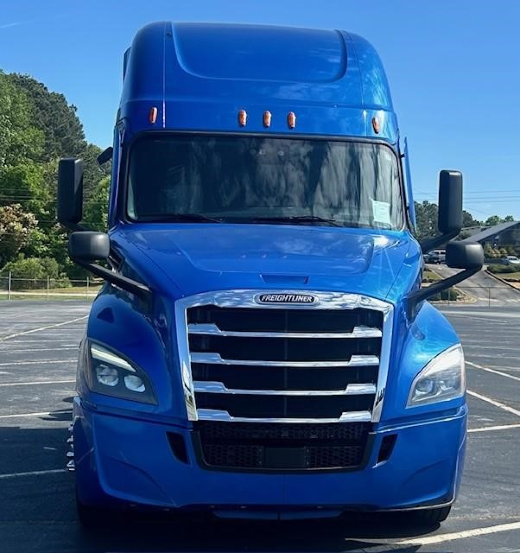 Freightliner Cascadia 126 front view showing blue exterior, grille, headlights, and mirrors.
