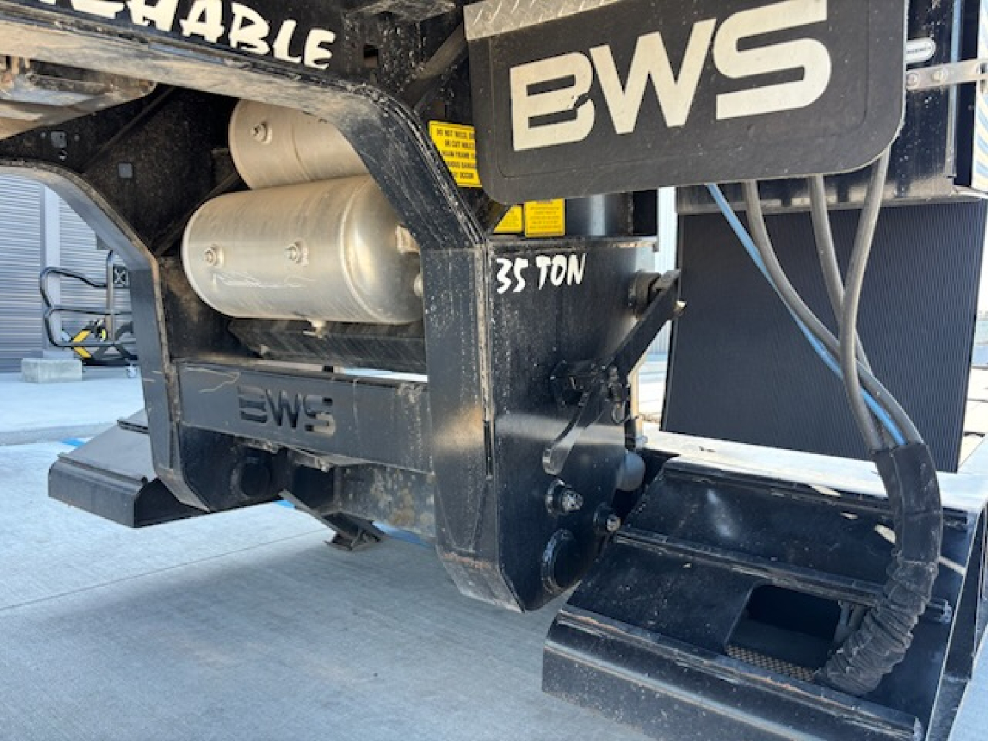 BWS AGRN trailer hitch section showing welded frame, hydraulic components, and BWS branding.