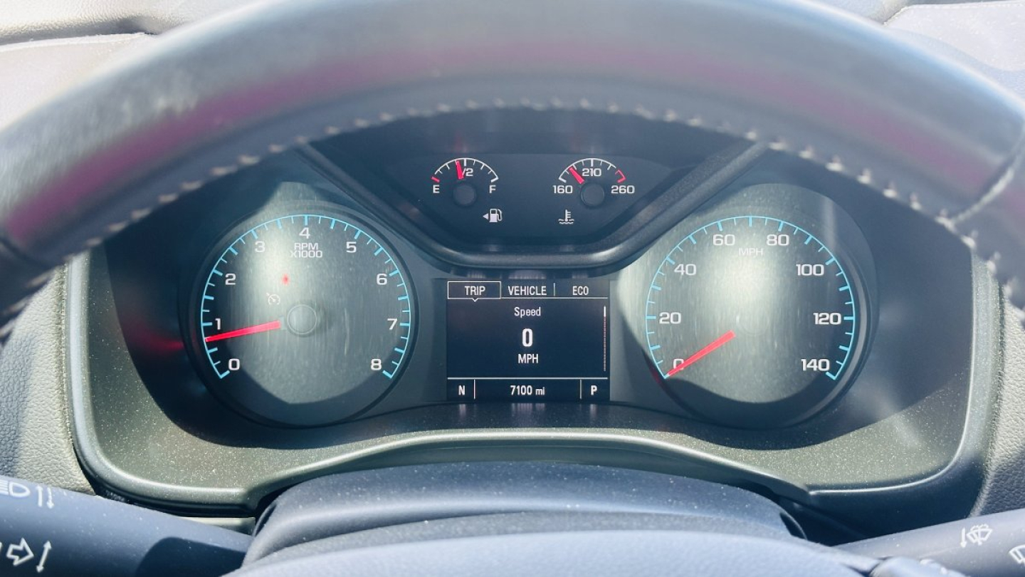 GMC Canyon cockpit dashboard showing speedometer and tachometer with central digital display.