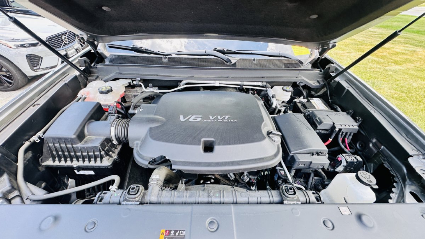 GMC Canyon engine bay showing V6 VVT badge on engine cover and surrounding components.