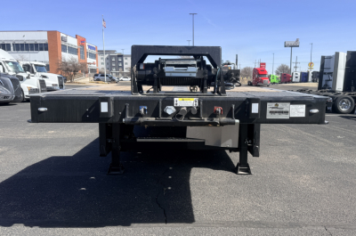 Landoll 440B-53 40 Ton traveling axle lowboy trailer rear view showing certification labels and hitch area.
