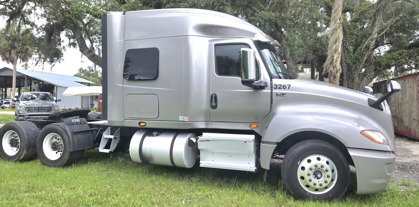 2019 International LT625 Condo sleeper truck side view showing cab, fuel tanks, and rear chassis with dual rear axles.