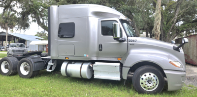2019 International LT625 Condo sleeper truck side view showing cab, fuel tanks, and rear chassis with dual rear axles.