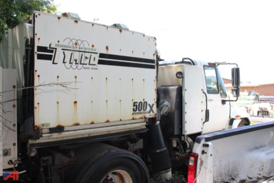 International DuraStar 4300 Tymco Sweeper truck in side view showing 500X engine area and recycling container.