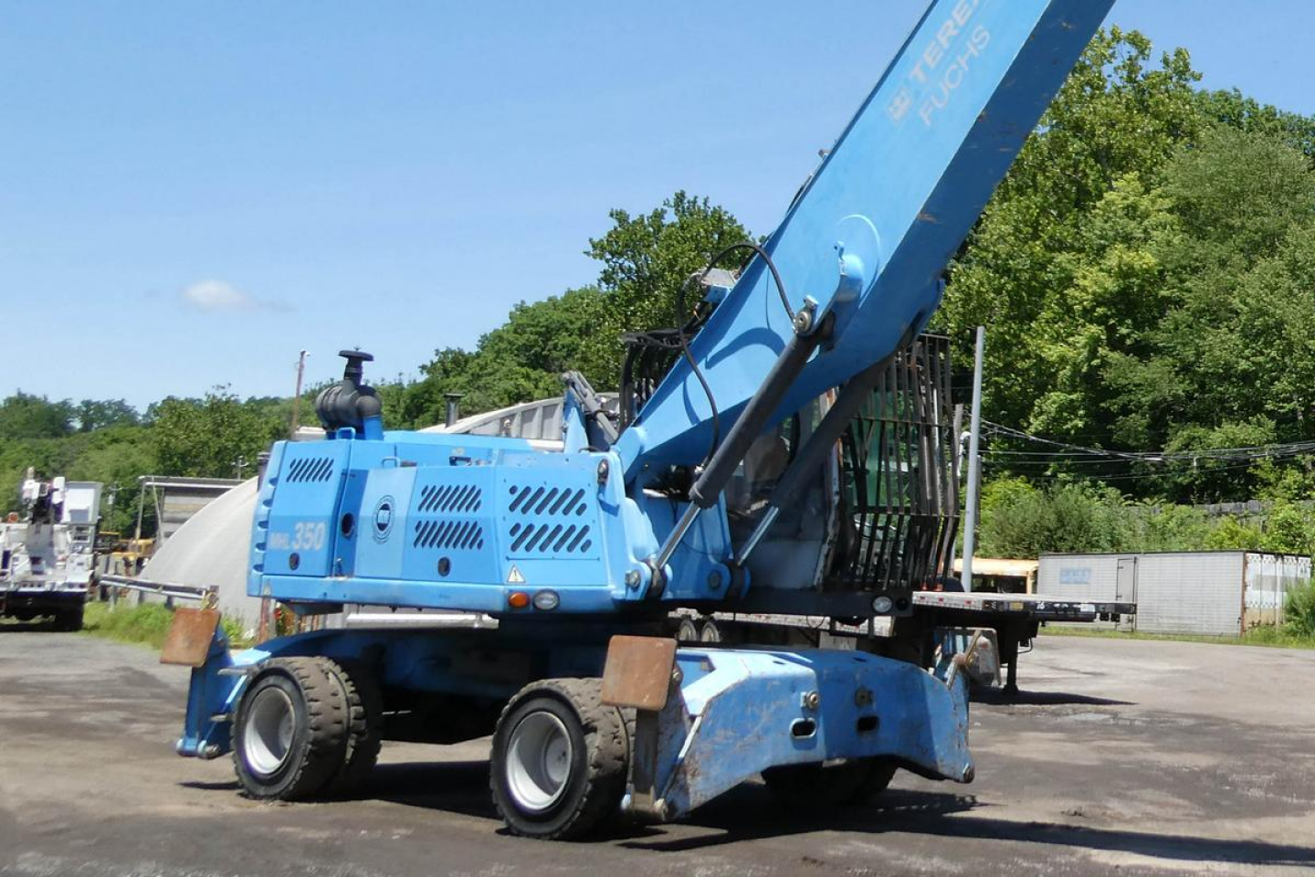 Terex MHL350D crane in blue with articulated boom, side view showing model markings and structural components.