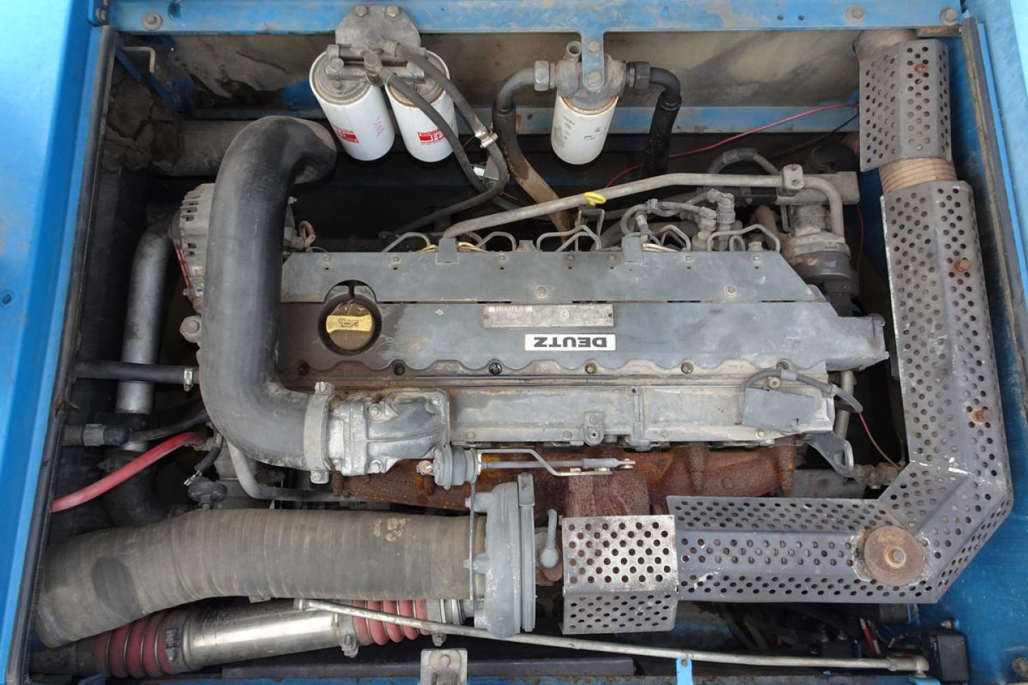 Terex MHL350D engine bay showing Cummins/Det? engine with air filter housings and hoses visible.