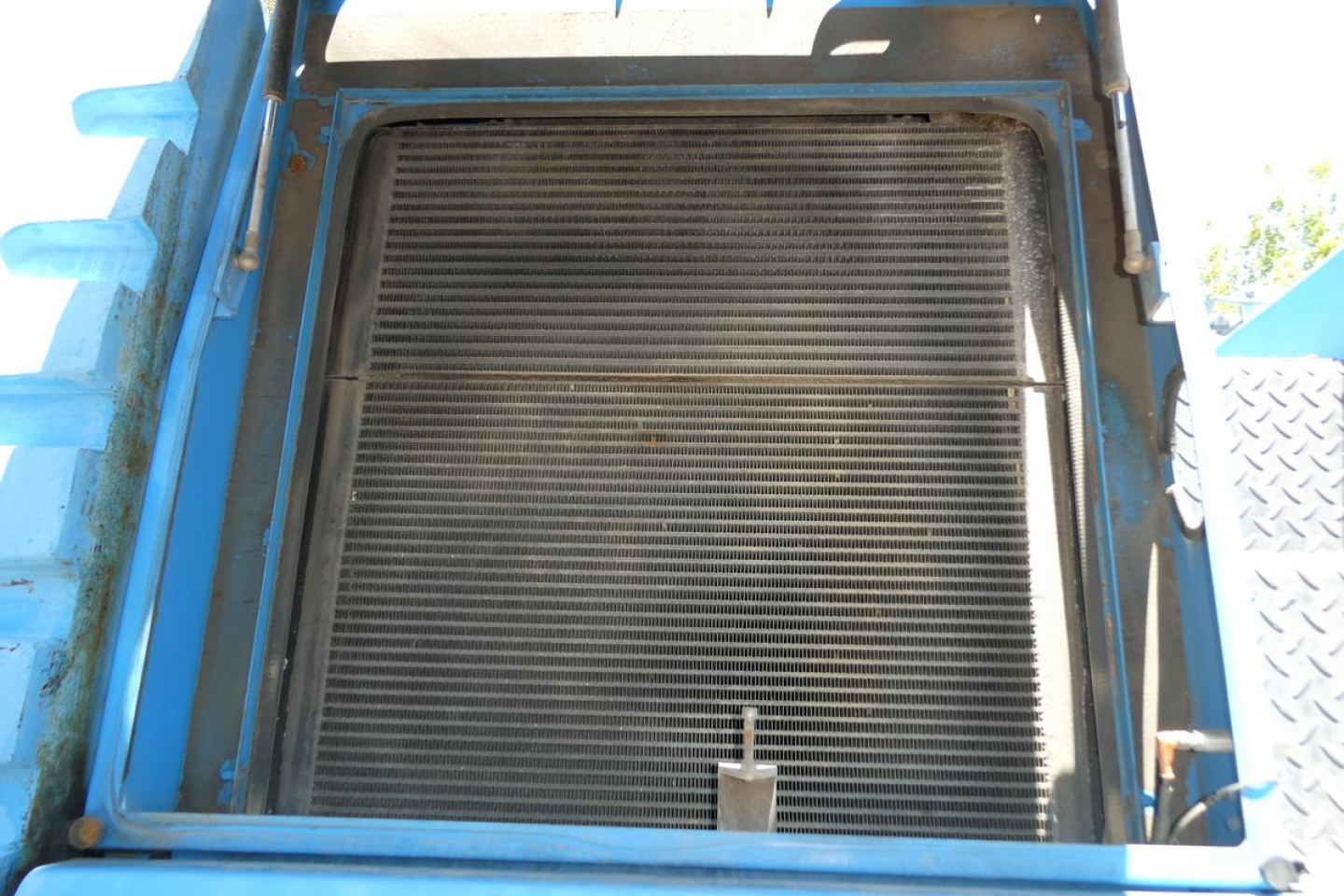 Terex MHL350D equipment interior showing radiator/grill assembly and surrounding blue frame.