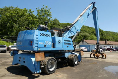 Terex MHL350D mobile hydraulic crane in blue showing MHL350D and payload grapple at the end of the boom.