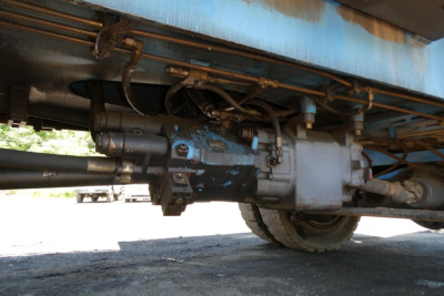 Terex MHL350D undercarriage showing hydraulic components and powertrain connection beneath the frame.