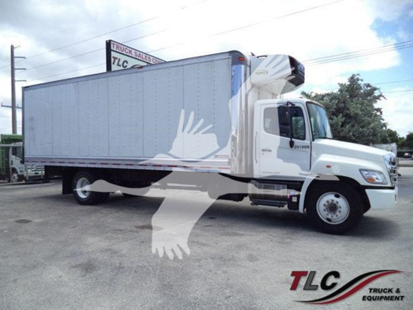 2019 Hino 268a refrigerated truck side view showing box body and cab with TLG logo.
