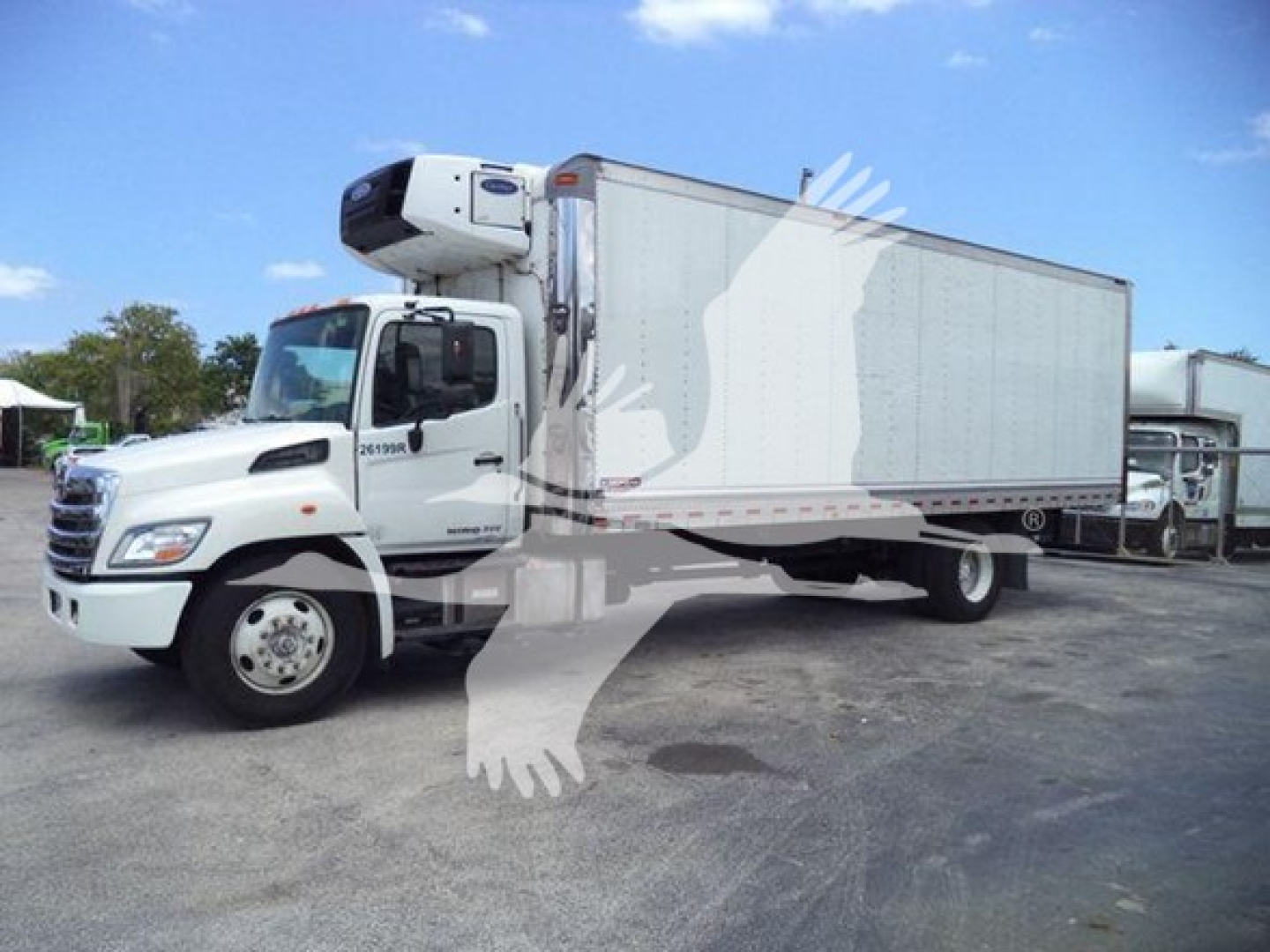 Truck cab and refrigerated box trailer with front refrigeration unit visible. Side shows stock number 26199R and truck branding.