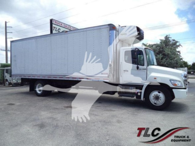 2019 Hino 268a refrigerated truck side view showing box body and cab with TLG logo.