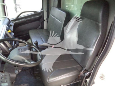 Truck cab interior of a 2019 Hino 268a refrigerated truck showing two front seats, steering wheel, dashboard, and door panels.