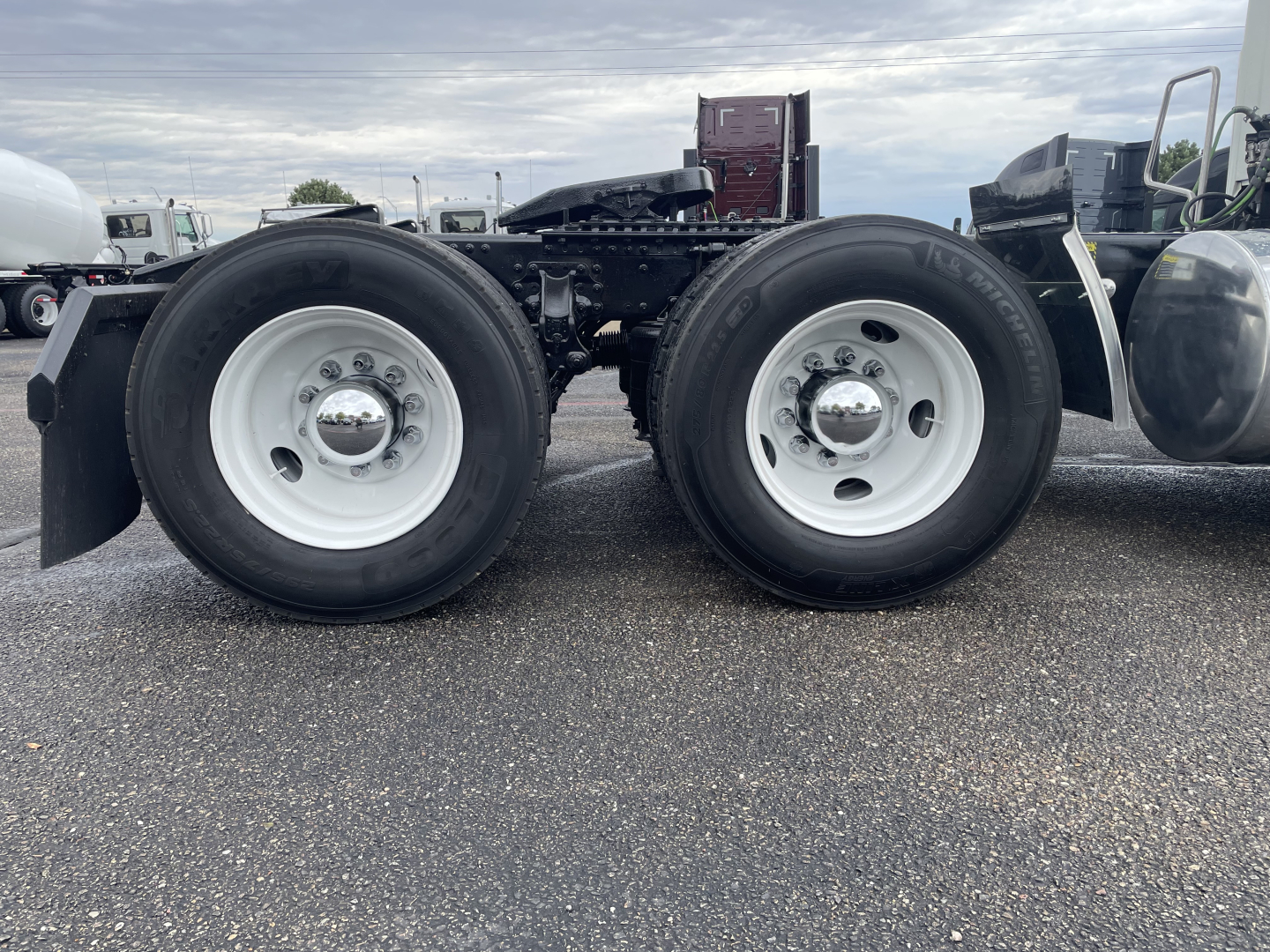 Mack AN64T truck axle back view showing dual rear wheels with white rims and black tires.