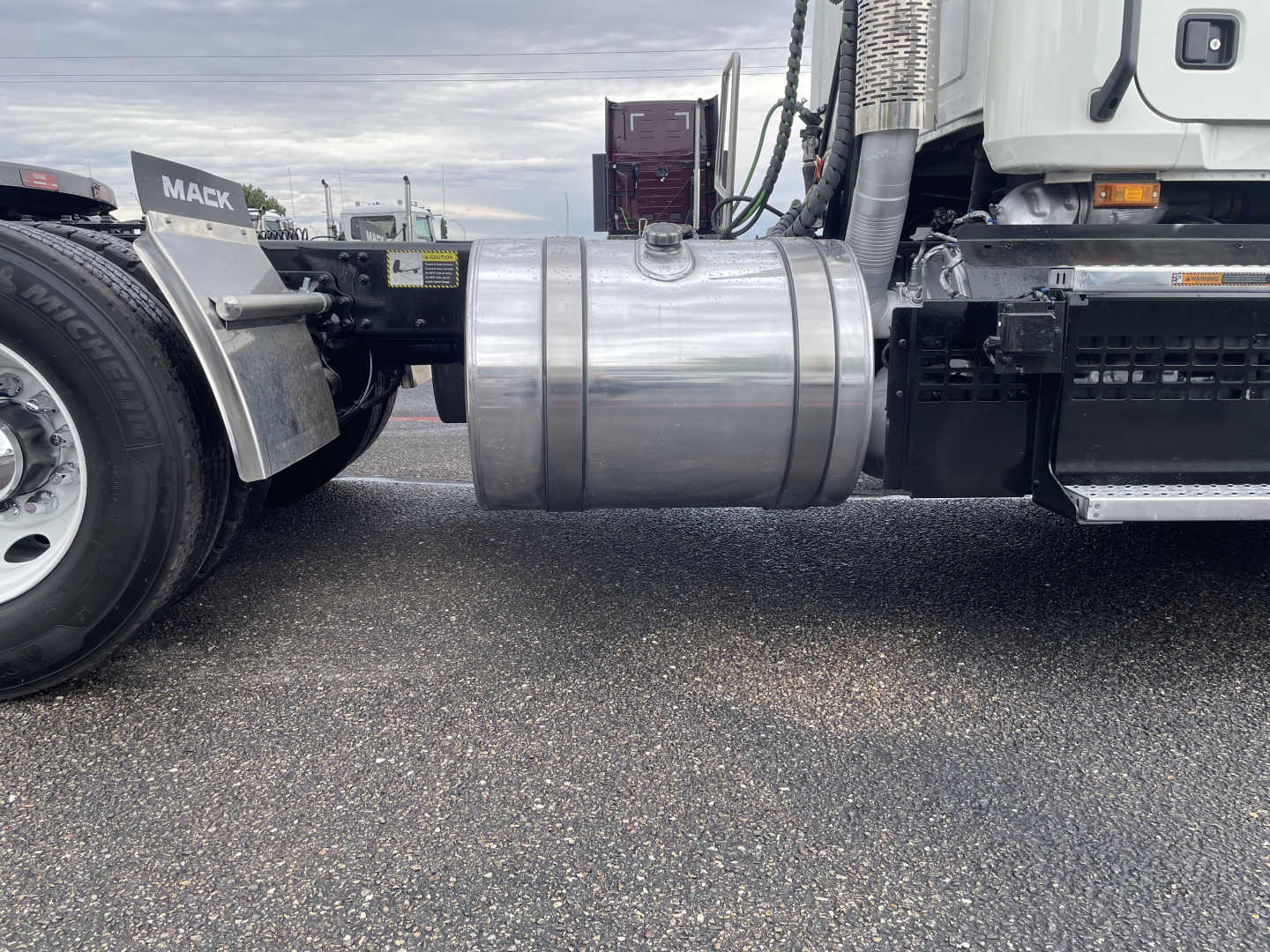 Mack AN64T conventional daycab drivetrain side view showing fuel tank and chassis area