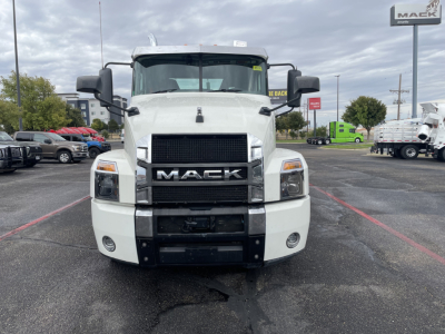 Front view of a white Mack AN64T conventional daycab truck showing grille, bumper, headlights, and side mirrors.