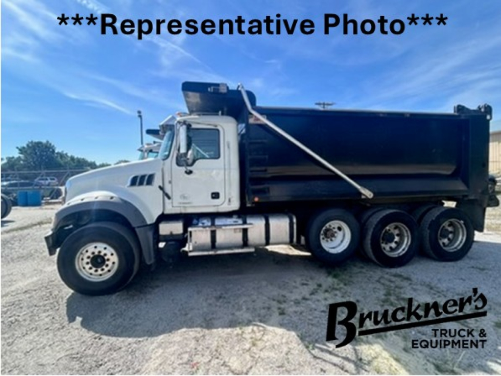 Dump truck side view showing 2020 Mack GR64F with dump bed, chrome fuel tanks, and three rear axles; 'Representative Photo' text over image and Bruckner's Truck & Equipment logo.