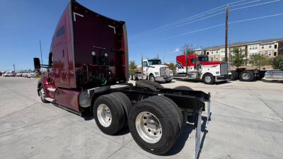 Kenworth T680 truck chassis and cab side view showing dual rear wheels and sleeper cab interior unseen with fifth wheel and frame.