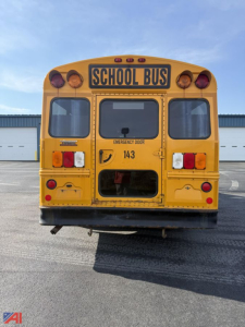 Rear view of a yellow 2014 Chevrolet Express G3500 mini school bus showing school bus sign, rear doors, tail lights, and emergency exit lettering.