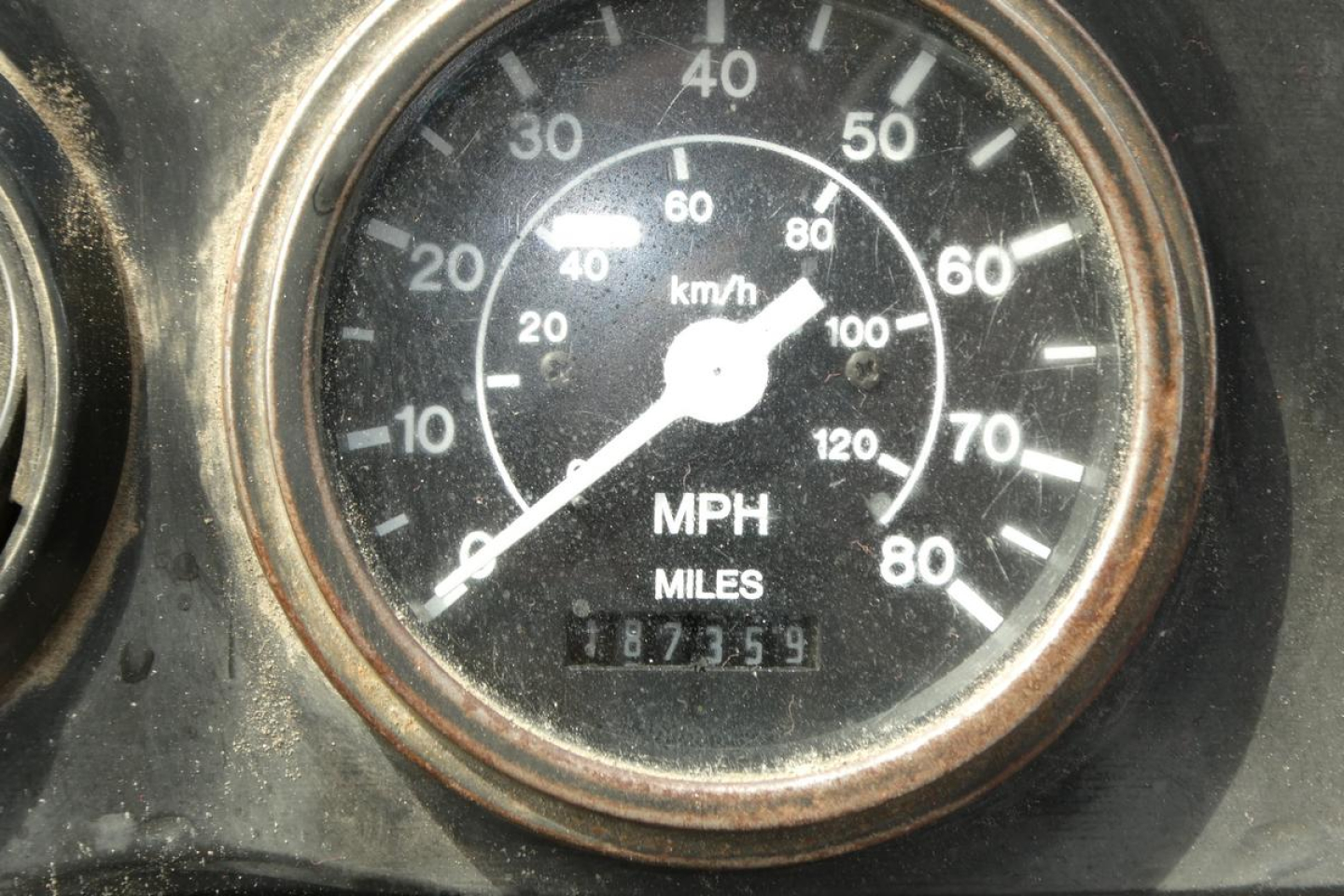 Gauge cluster showing speedometer with mph and km/h markings, odometer reading 187359 miles.