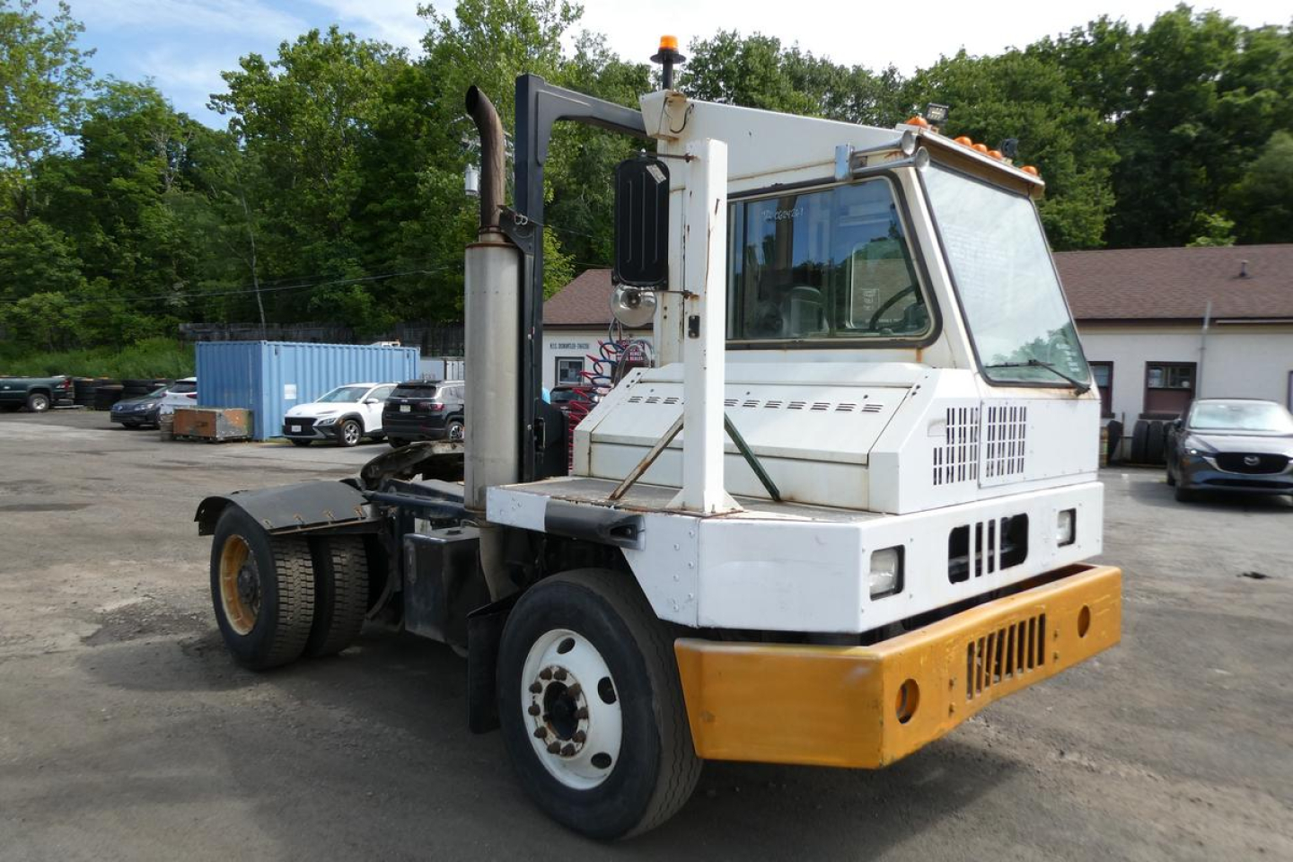 2011 Kalmar Ottawa YT50 yard truck in service view showing operator cab, lifting mast, and rear chassis.