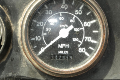 Gauge cluster showing speedometer with mph and km/h markings, odometer reading 187359 miles.