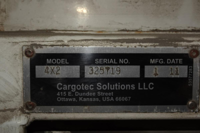 Plate on Kalmar Ottawa YT50 showing Model 4X2, Serial No. 325719, MFG Date 11/2011, Cargotec Solutions LLC address in Ottawa KS.