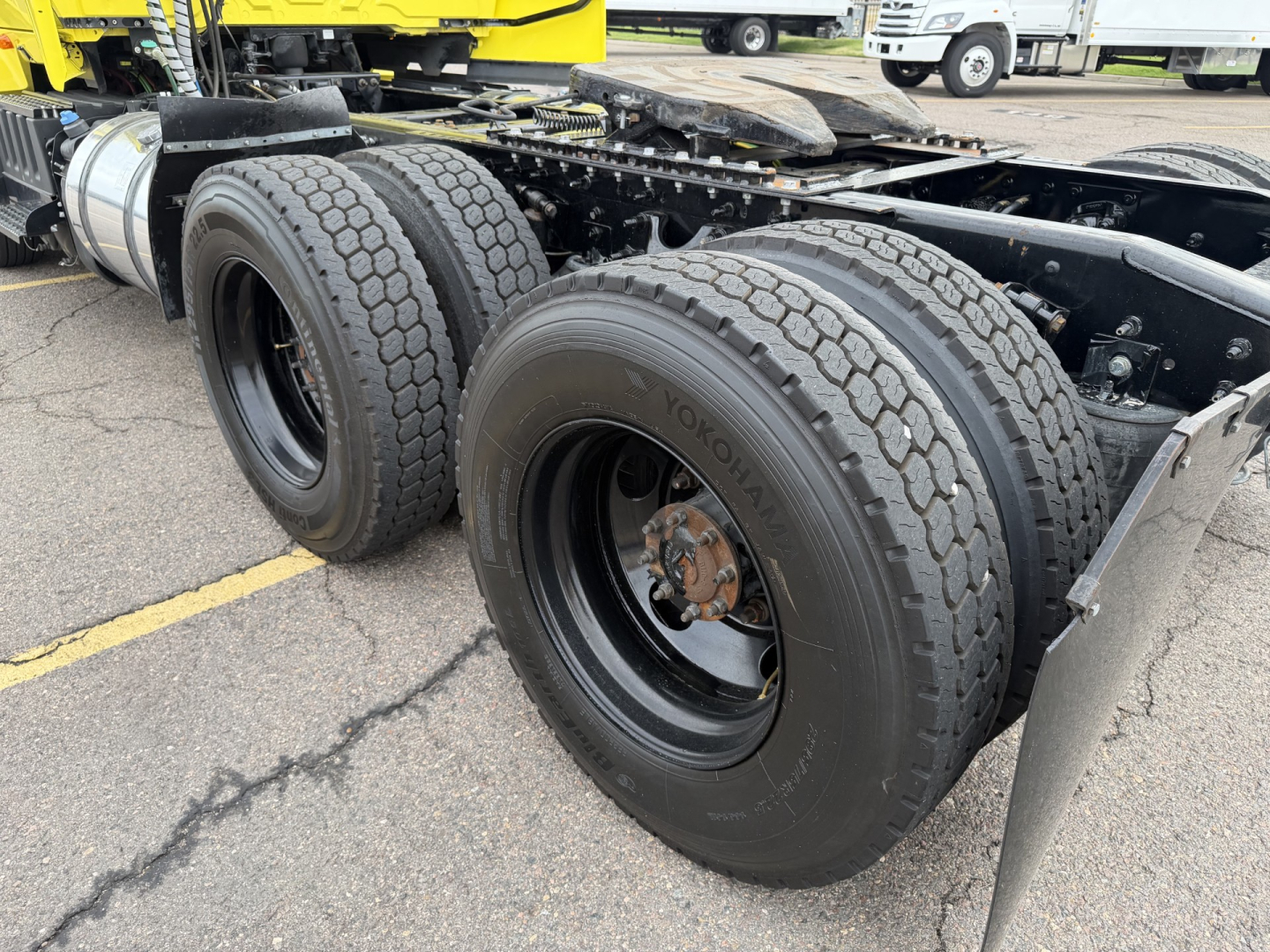Heavy-duty truck tandem axle chassis showing rear dual tires and Yokohama tires, part of a 2023 International LT625 conventional daycab.
