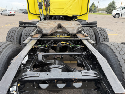 Truck frame and rear drivetrain showing fifth wheel area and suspension of a 2023 International LT625 conventional daycab.