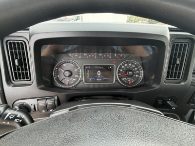 Dashboard of a 2023 International LT625 truck showing instrument cluster and steering wheel; visible text includes odometer reading 0, various gauges, and a digital display.