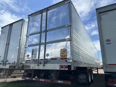 Trailer rear view of a 2018 Utility 3000R refrigerated trailer with dual rear doors, metal exterior, and red/white reflective tape.
