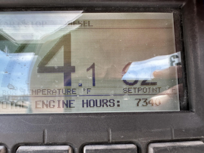 Trailer cab display showing engine hours 7340 and temperature/SETPOINT readouts in an in-cab monitor.