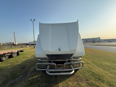 Front view of a 2020 Mack PI64T truck cab showing the front bumper and grille; no visible text readable on the bumper or hood.
