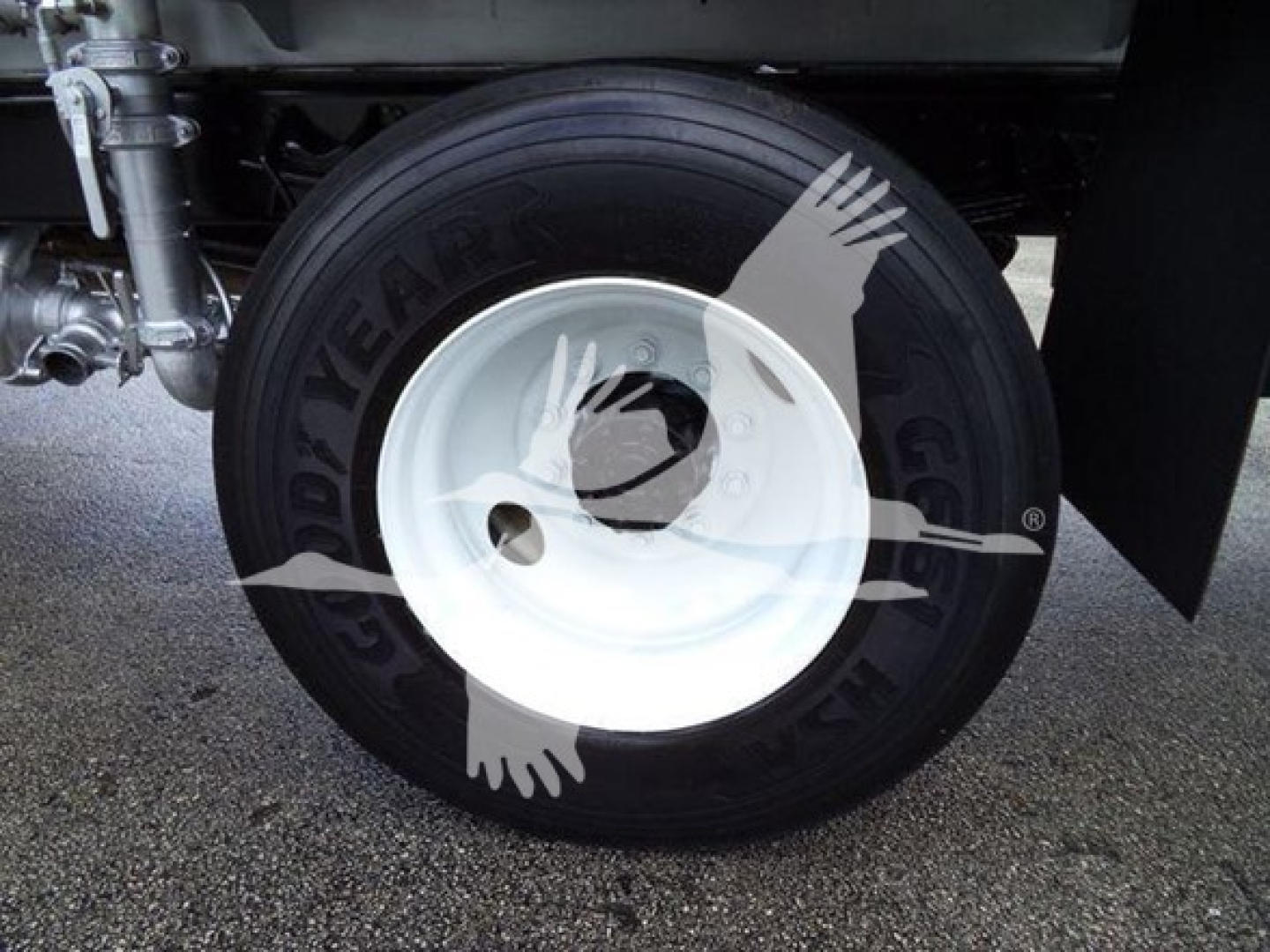 Front wheel and tire of a 2015 Ford F650 Sd showing Goodyear tire and white steel rim with hub area visible.