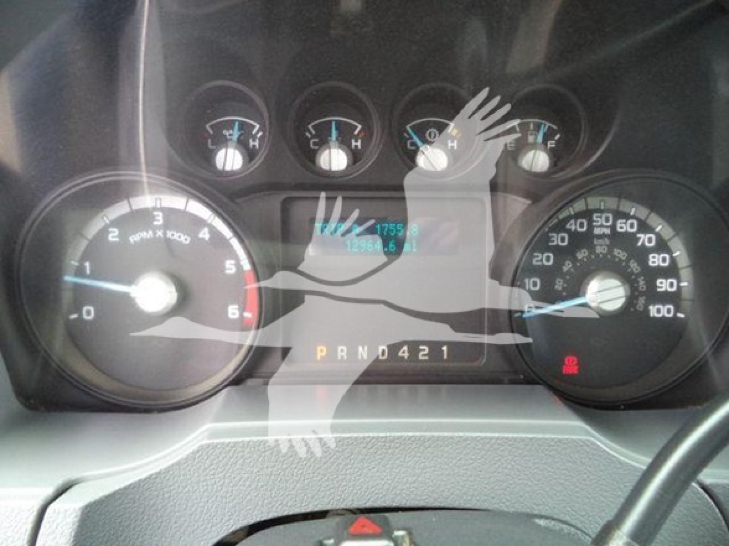 Dashboard of 2015 Ford F650 truck showing instrument cluster, gauges, and gear selector with PRND421 display.
