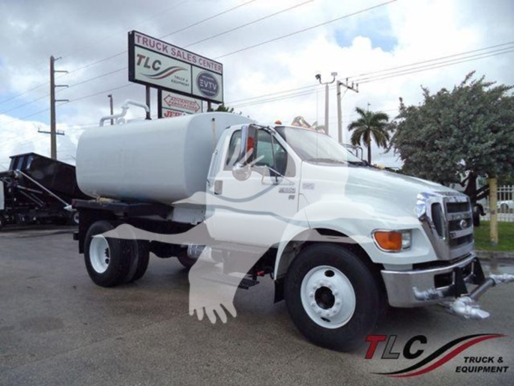 Ford F-Series medium-duty truck with a large cylindrical tank on its chassis, front grille, headlights, and side mirrors. No visible readable labels or text on the body aside from generic branding.