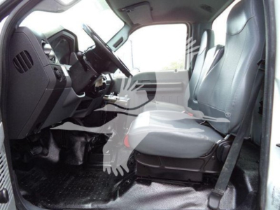 Ford F-650 cab interior showing front seats and dashboard with steering wheel and center console.