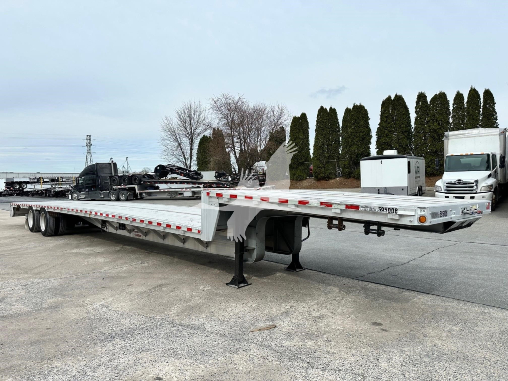 Trailer showing a 2019 Reitnouer Dropmiser with a long drop deck trailer and wheel-lift, VIN 1RND53A28KR049396, stock 7630, used condition.