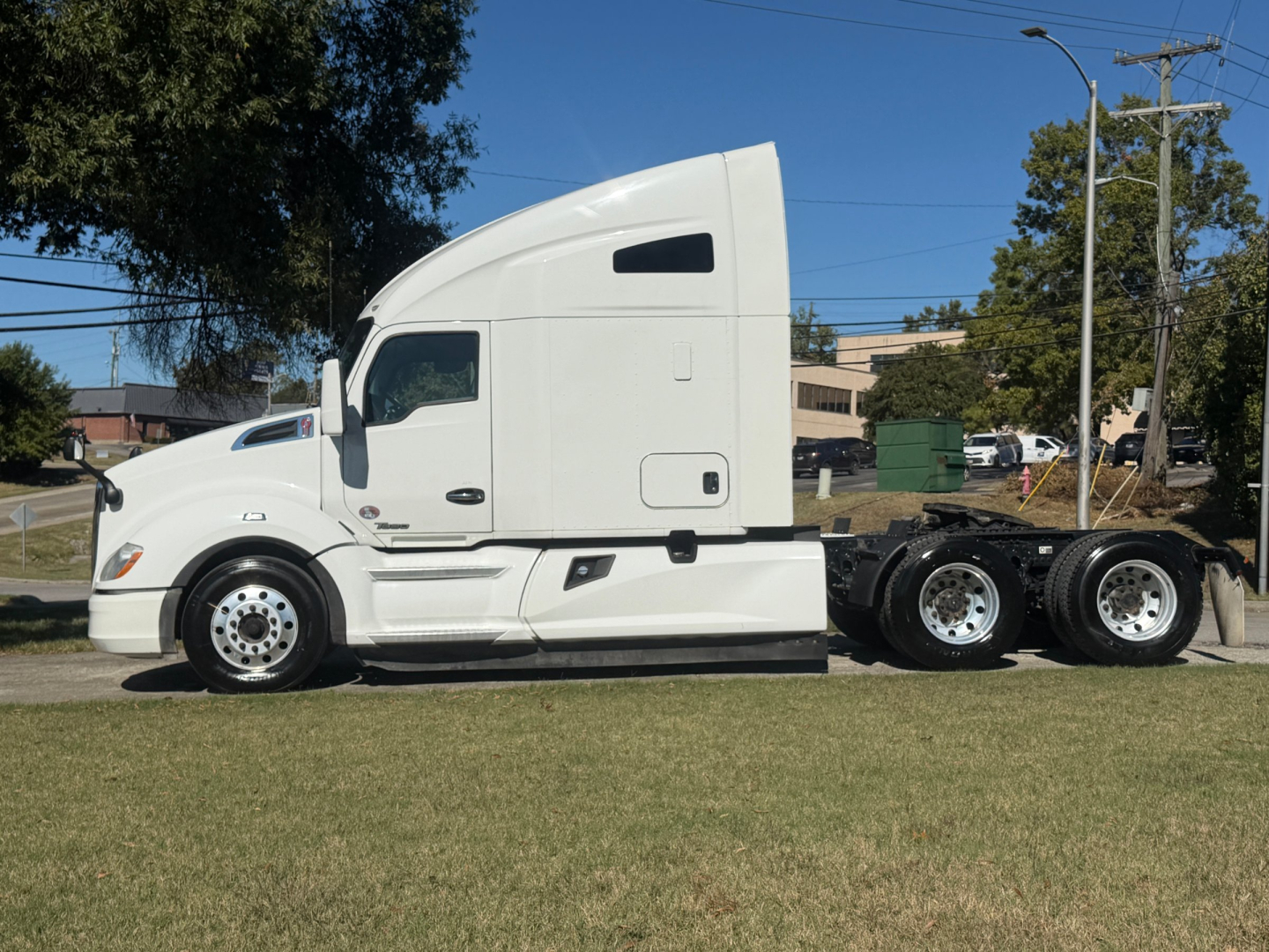 Kenworth T680 sleeper cab tractor in profile view showing side, tires, and chassis