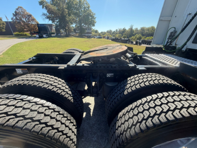 Kenworth T680 chassis with dual rear axles and fifth-wheel connection visible.
