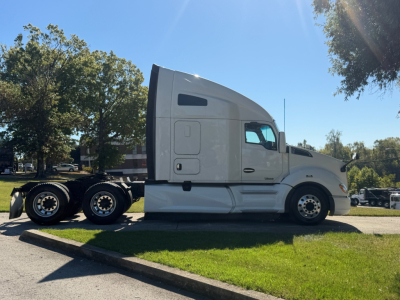 Kenworth T680 tractor unit side profile showing sleeper cab and dual rear axles.