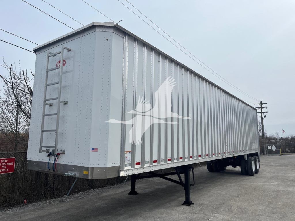 Trailer side view showing a Dorsey walking floor trailer with stock number VED48298 and VIN 7KYCW4529VED48298 in a lot.