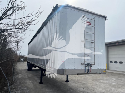 Trailer showing a Dorsey walking floor trailer with gray exterior, rear ladder, and support legs. Visible text includes VIN plate details and stock number VED48298.